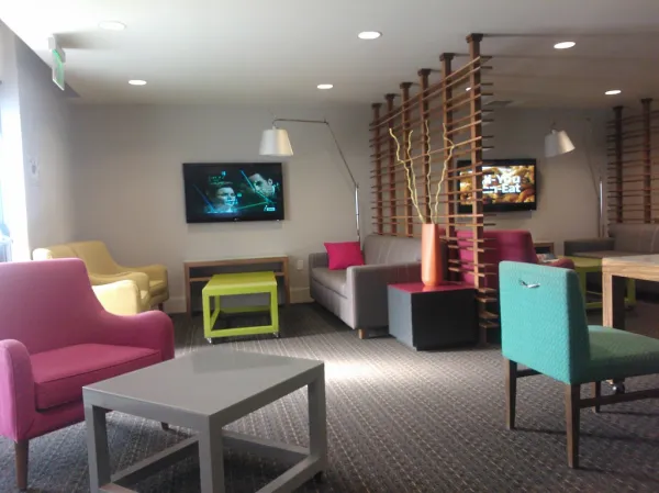 Avatar Hotel, contemporary meeting room, individual TVs, sofas, tables, light, dividers, Santa Clara, California, USA