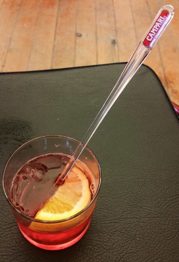 Campari with swizzle stick at Affiches exhibition opening, Alliance Francaise de Melbourne, Grey Street, St Kilda, Victoria, Australia