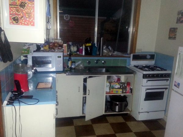 This is my kitchen. It's really a bit too small. The bench and cupboards are often full to overflowing. But it has a beautiful blue benchtop and splashback, a gas oven and stove, and it's mine. After years of insecurity I have somewhere I can cook in, s