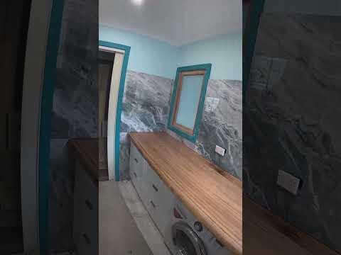 Laundry tiles are in Victorian ash bench top Beautiful
